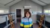 Lazaro in a camping cabin with a big smile.