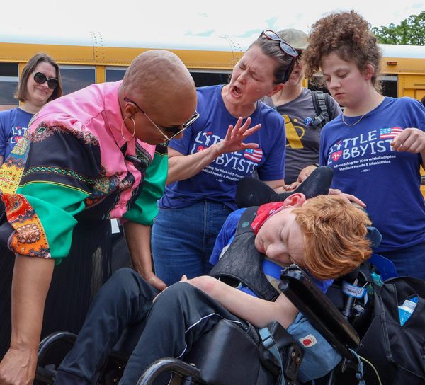 Meghann Luczkowski, Congresswoman Ayanna Pressley, Laura Robeson, Danny Robeson, and Nori Childers at a Medicaid vigil.