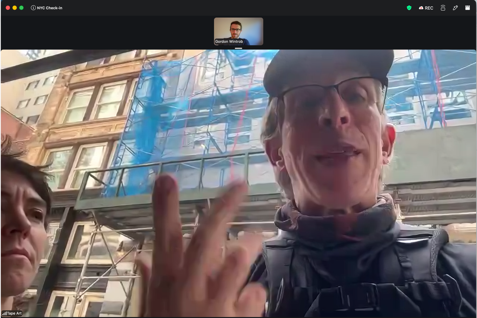 Mike and Leah join a Zoom call from a Manhattan sidewalk while testing the walking tour, with Gordon in a small video tile.