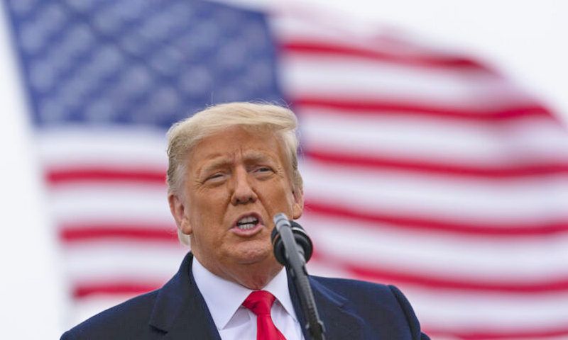 President Donald Trump speaks near a section of the U.S.-Mexico border wall in Alamo, Texas, on Jan. 12, 2021. (Alex Brandon/AP Photo)