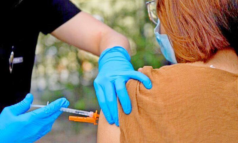 A 15-year-old receives a COVID-19 vaccine at a mobile vaccination clinic at the Weingart East Los Angeles YMCA in Los Angeles, Calif., on May 14, 2021. (Patrick T. Fallon/AFP via Getty Images)