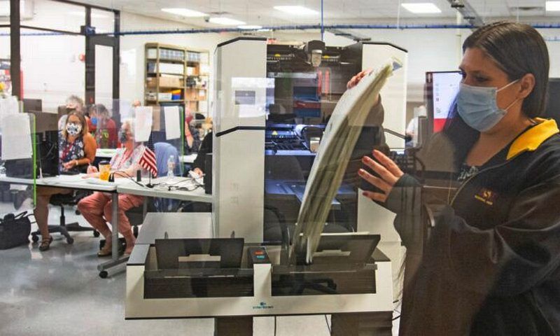 Votes are counted by staff at the Maricopa County Elections Department office in Phoenix, Ariz., on Nov. 5, 2020. (Courtney Pedroza/Getty Images)
