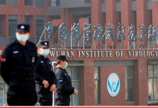 Security personnel keep watch outside the Wuhan Institute of Virology