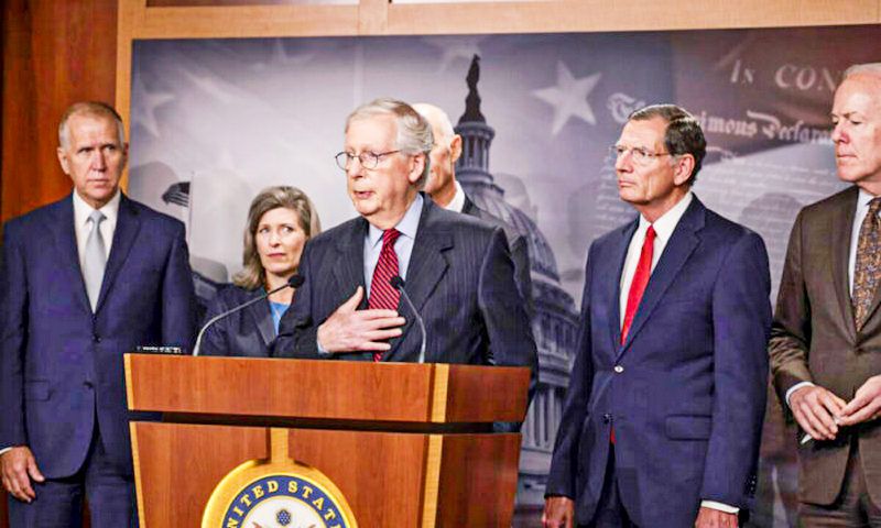 Senate Minority Leader McConnell (R-Ky.) (C) speaks to reporters as other senators stand by, in Washington on Sept. 22, 2021. (Anna Moneymaker/Getty Images)