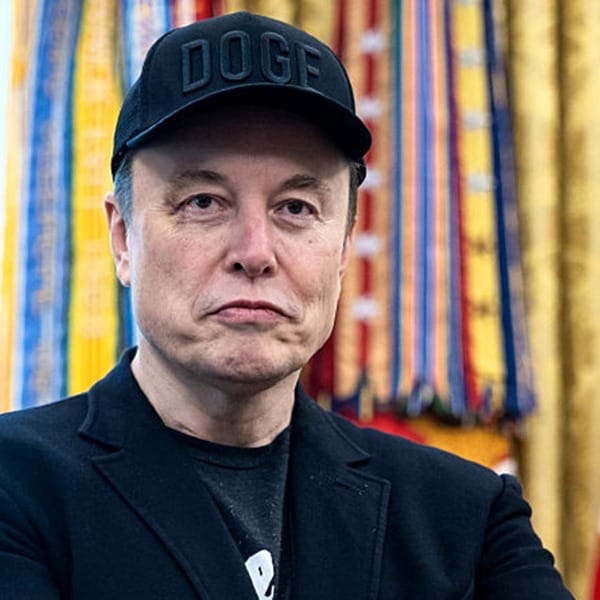 Elon Musk wearing "DOGE" hat