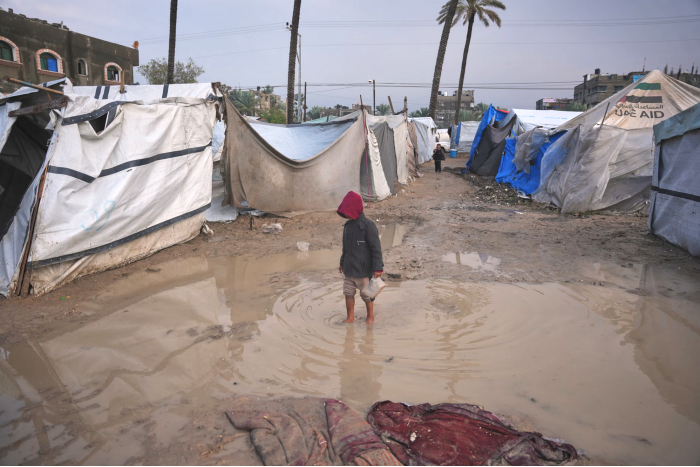 Families washed out of tents as flood waters course through Gaza