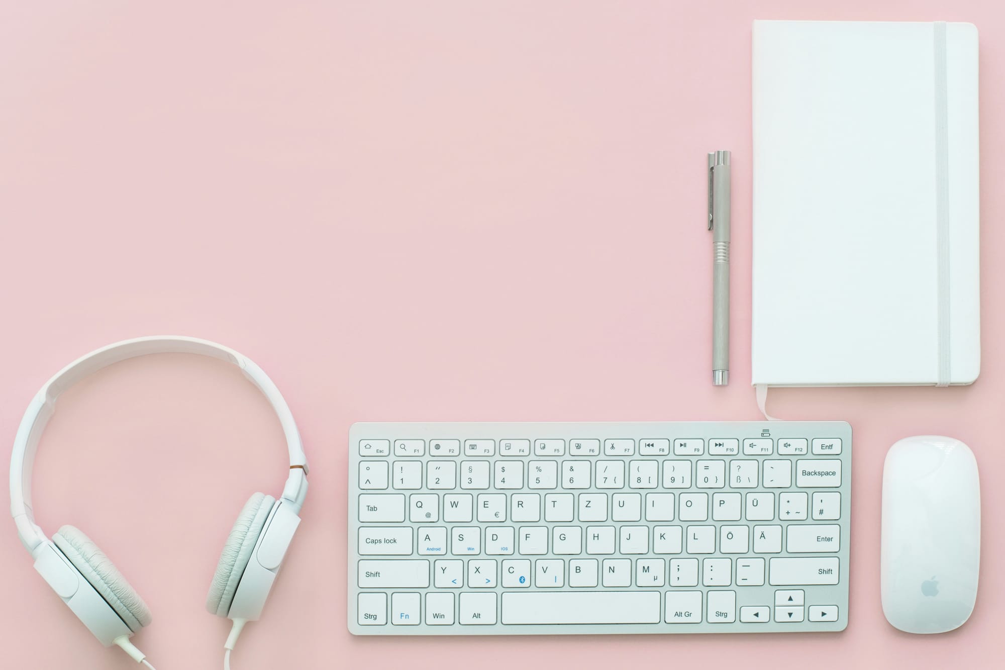 Office Stationery and technology on pink background