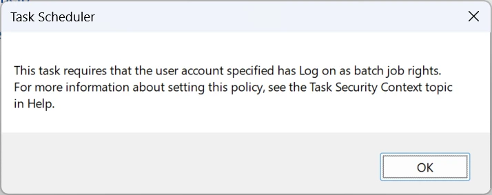 "Task scheduler" error dialog: "This task requires that the user account specified has Log on as batch job rights. For more information about setting this policy, see the Task Security Context topic in Help" with an "OK" button.