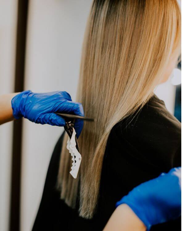 Botox hair treatment with brown womans hair at the salon