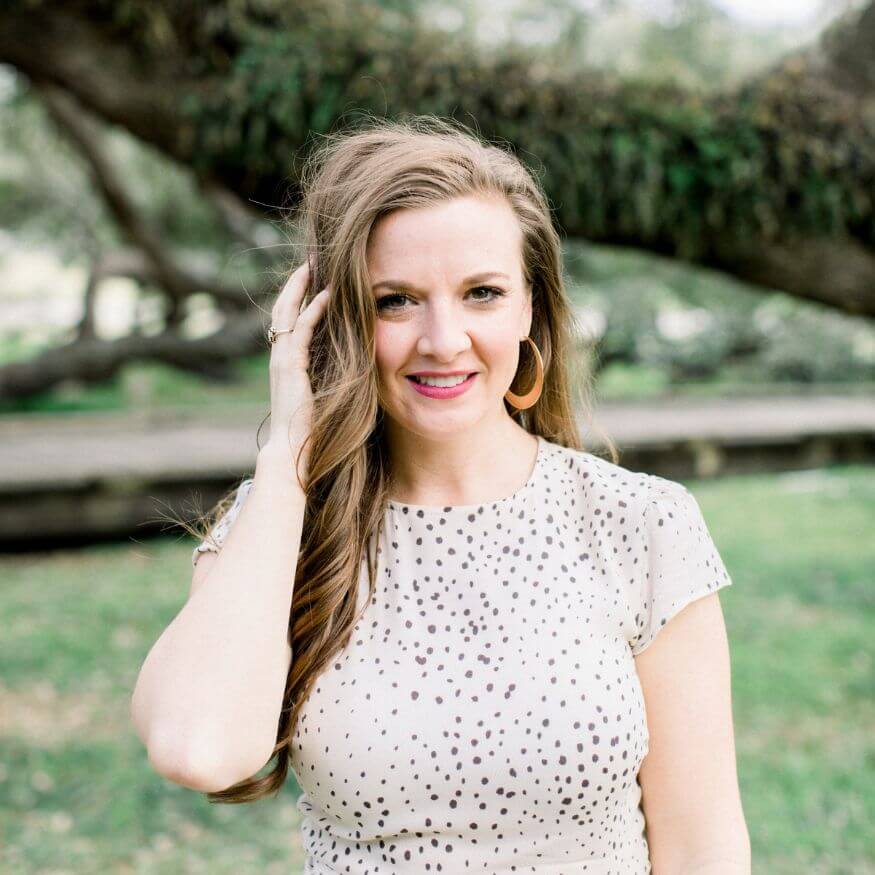 smiling woman in a polka dot dress, happy woman, touching hair
