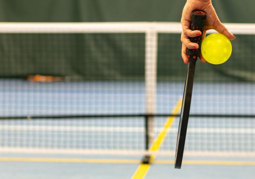 pickleball player holding paddle 