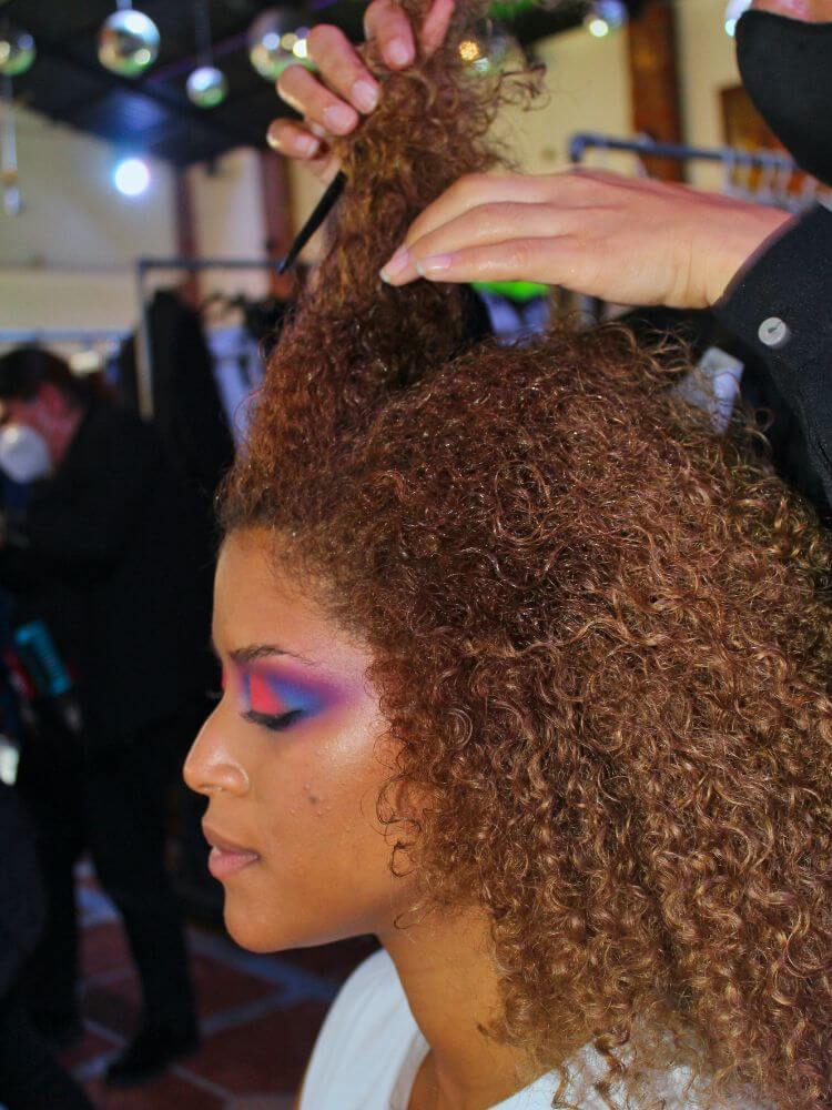 black woman at salon getting hair extensions