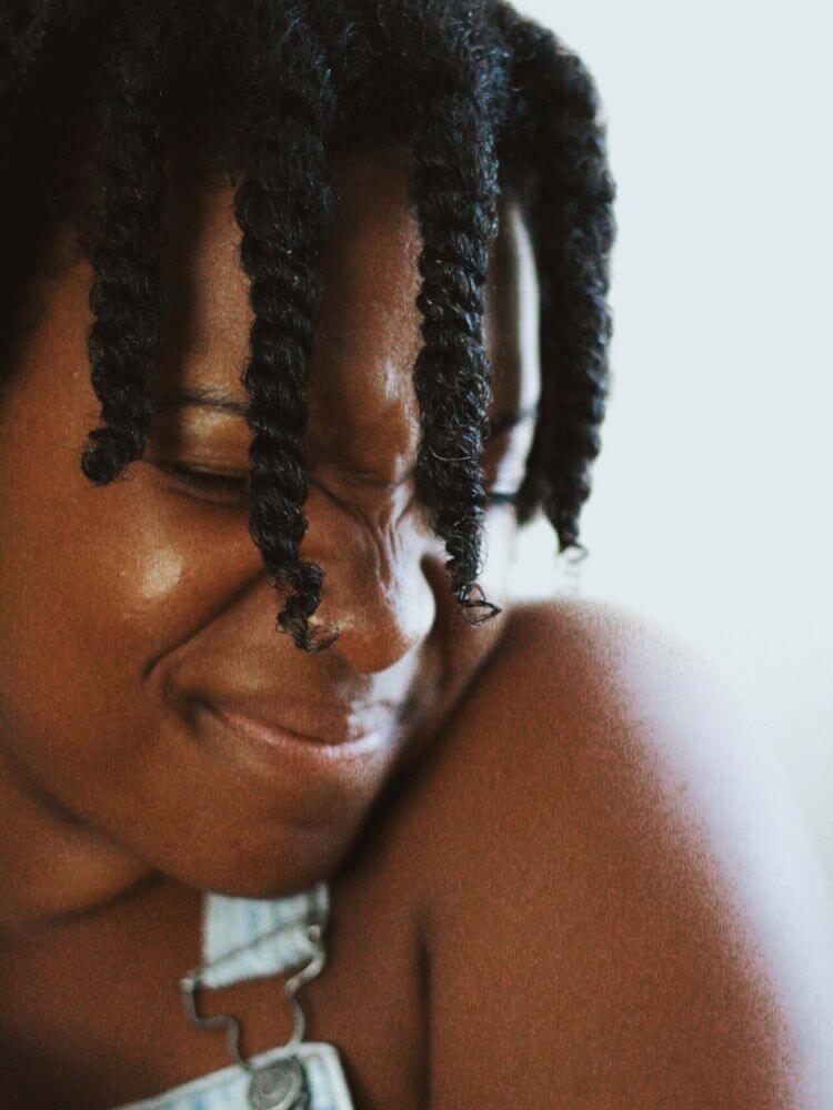 black woman squinting with cuban twist hair