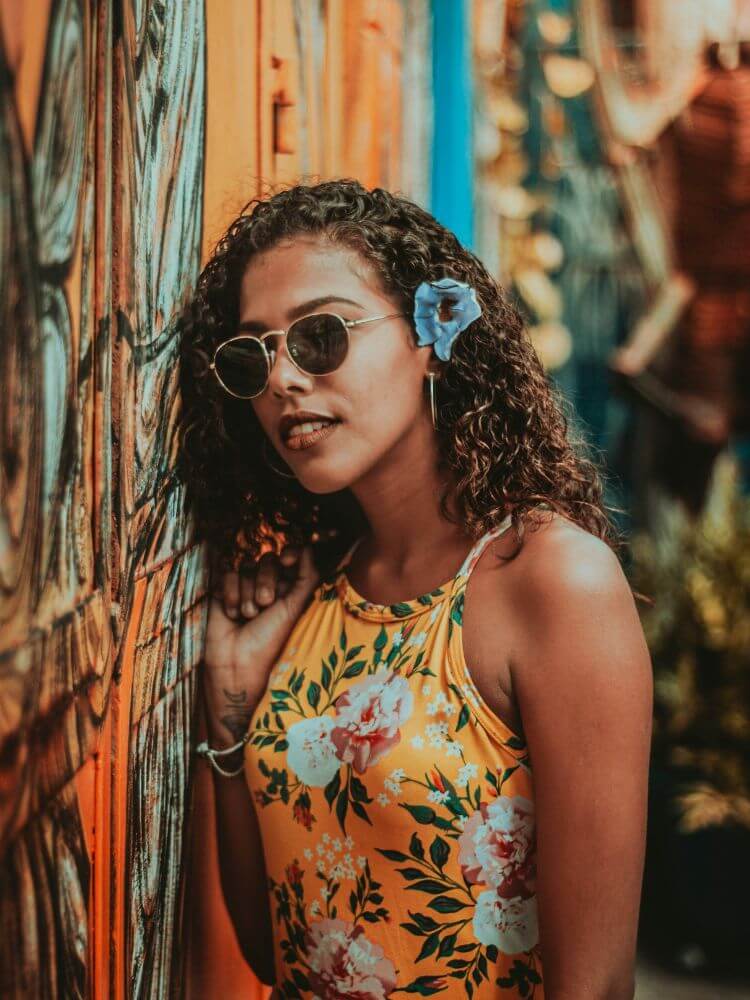 colorful dress with black woman and hair twist