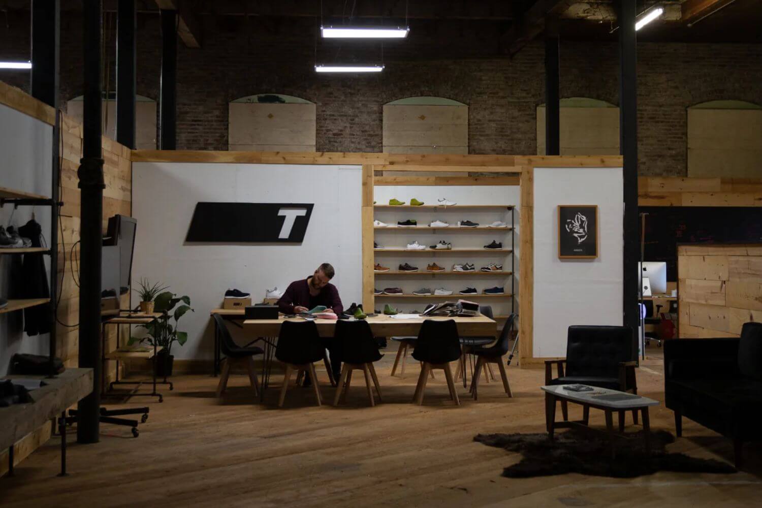 man at desk at true golf shoe store