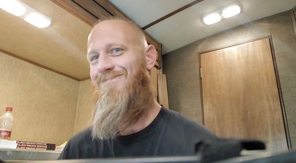 Springer smiling at the camera after encouraging his viewers to engage with a deputy of the Torrance County Sheriff’s Office.