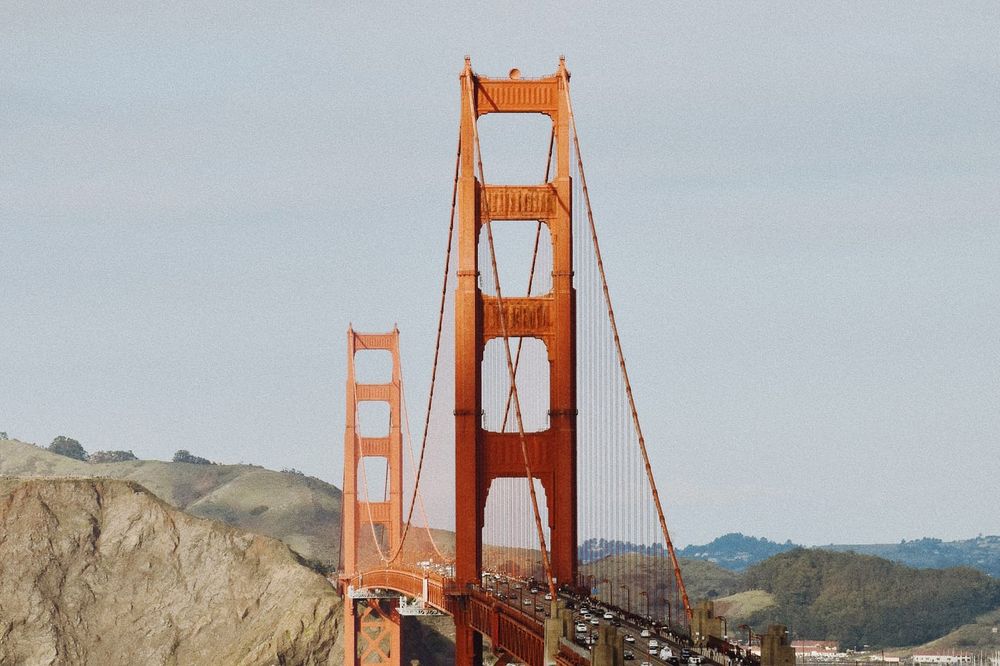 color street photography of orange Golden Gate Bridge in San Francisco