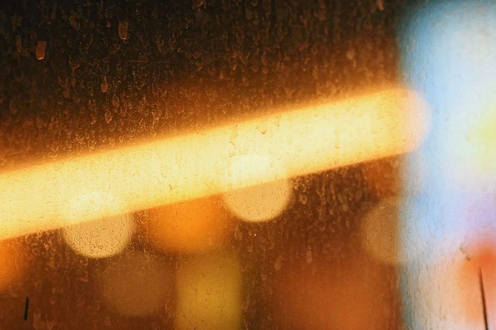 color street photography of yellow bokeh lights at night