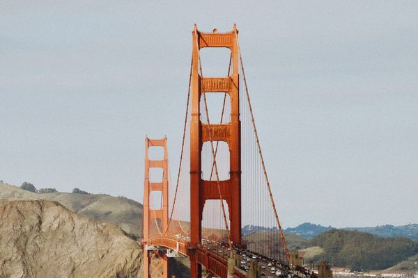 color street photography of orange Golden Gate Bridge in San Francisco