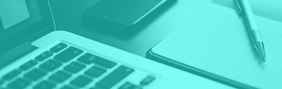 Part 2 of Close-up of Laptop with notebook, pen, and smartphone