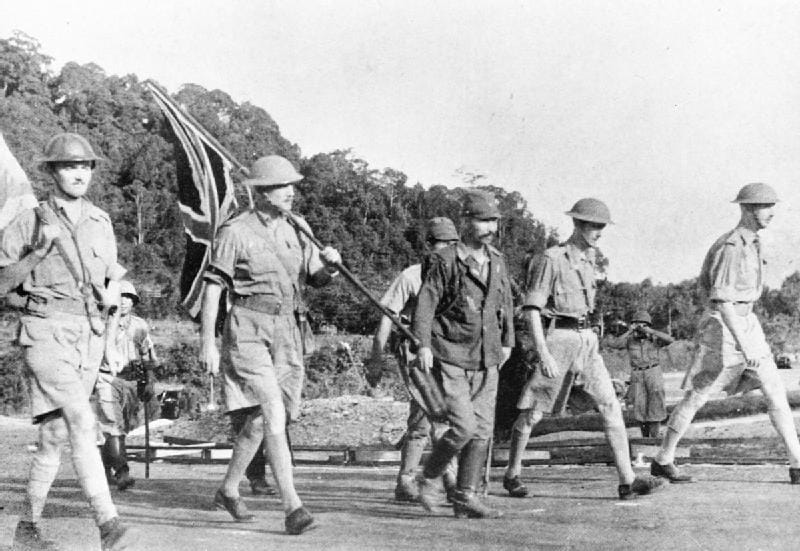 Lieutenant-General Percival and his party carry the Union flag on their way to surrender Singapore to the Japanese.