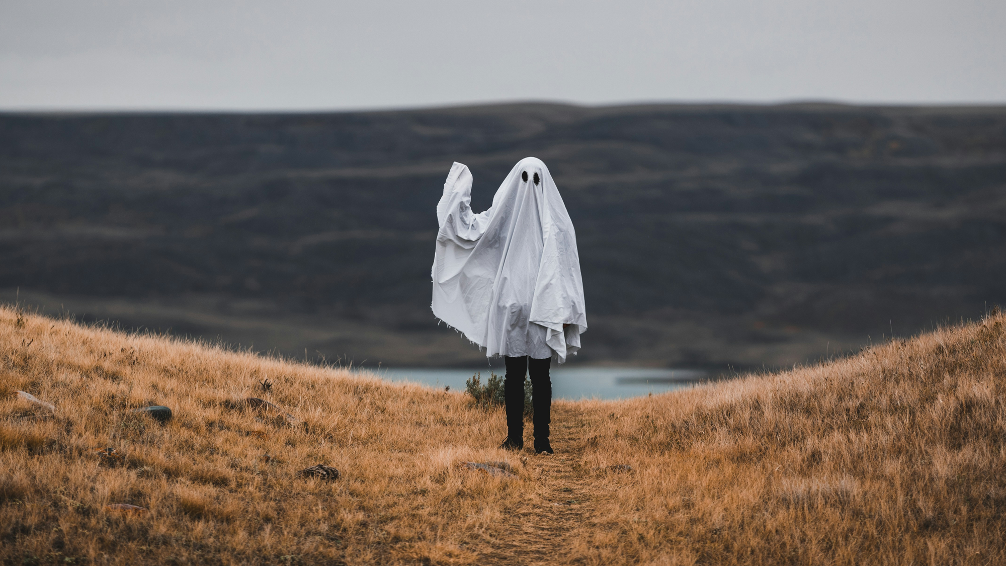 A ghost on a hill waving at you