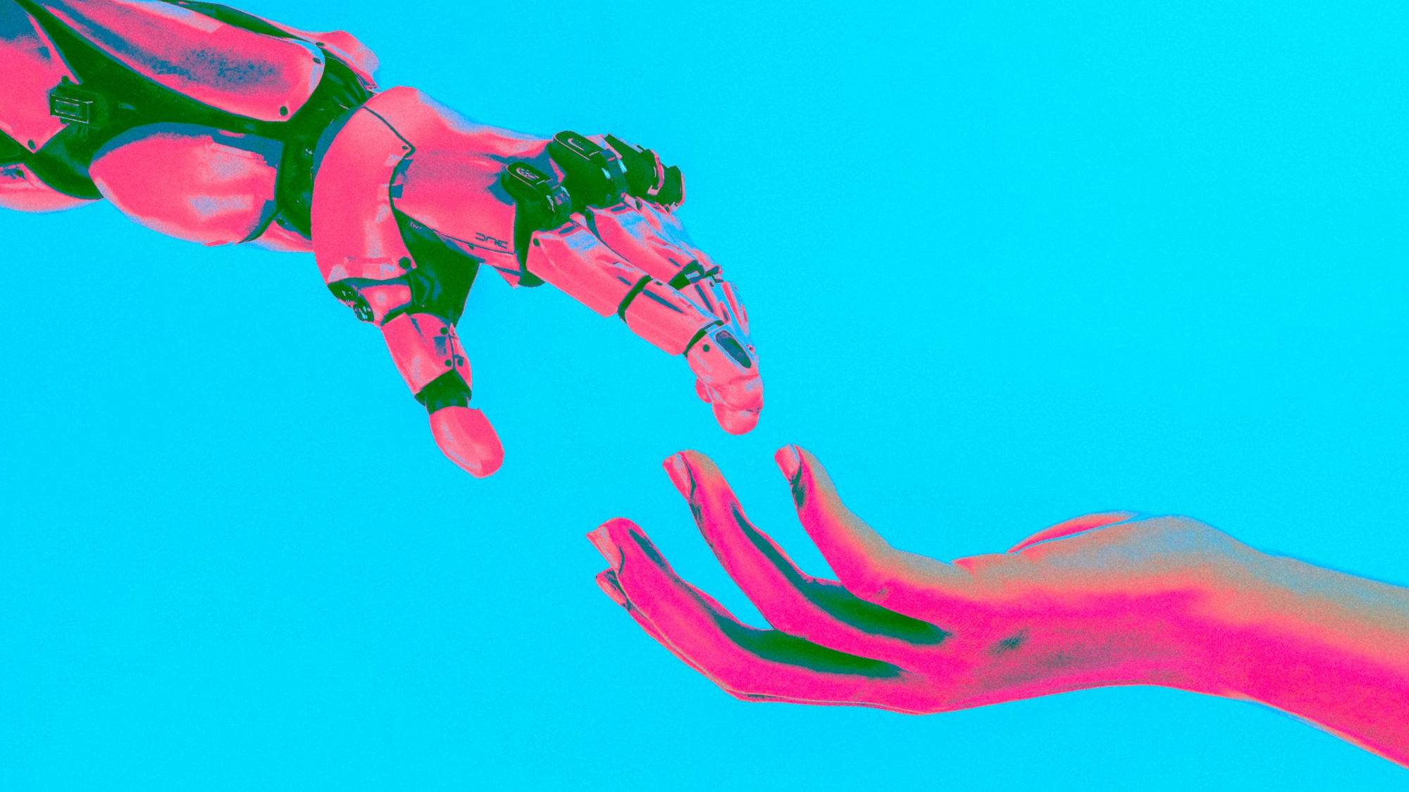 a robot and human hand reaching for one another