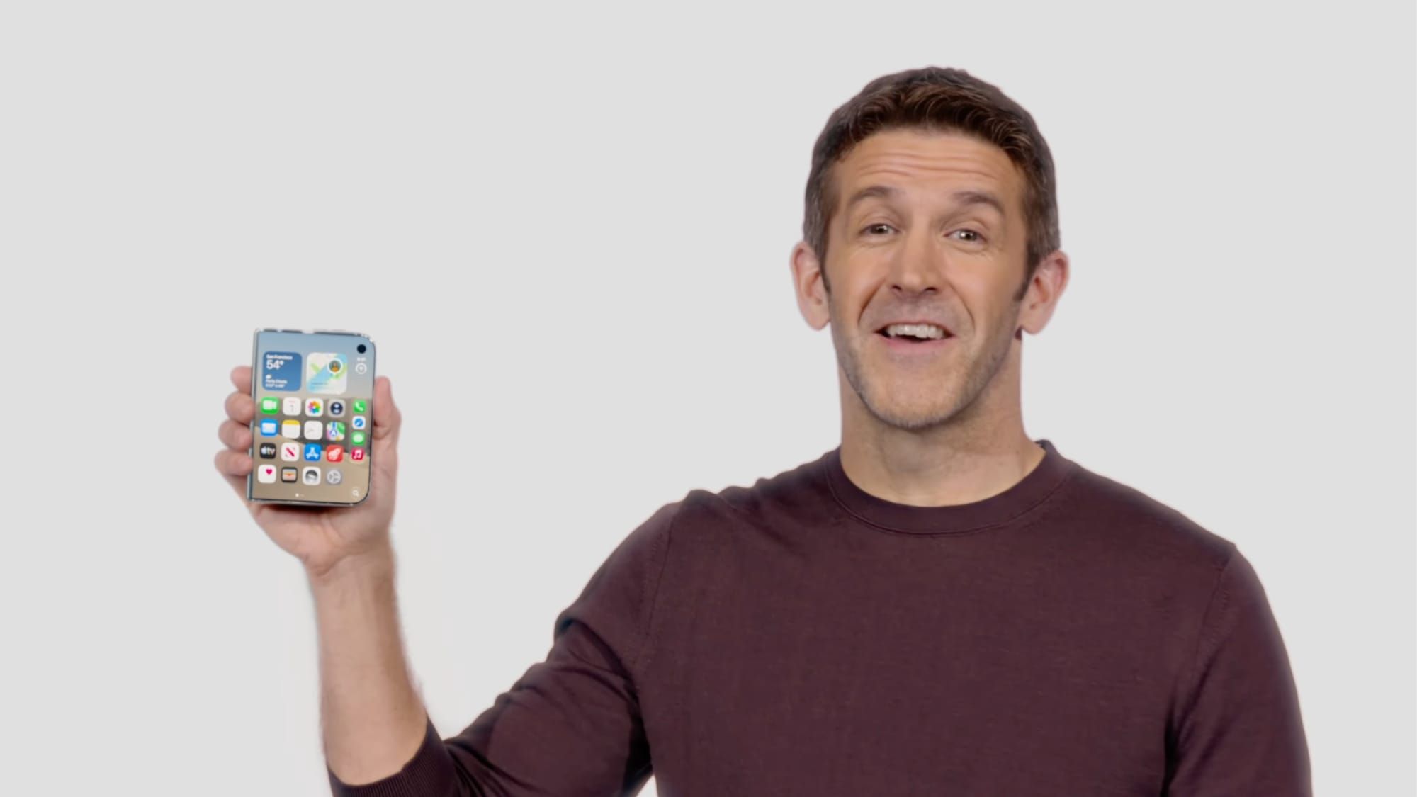 Apple CEO John Ternus holding the iPhone Duo