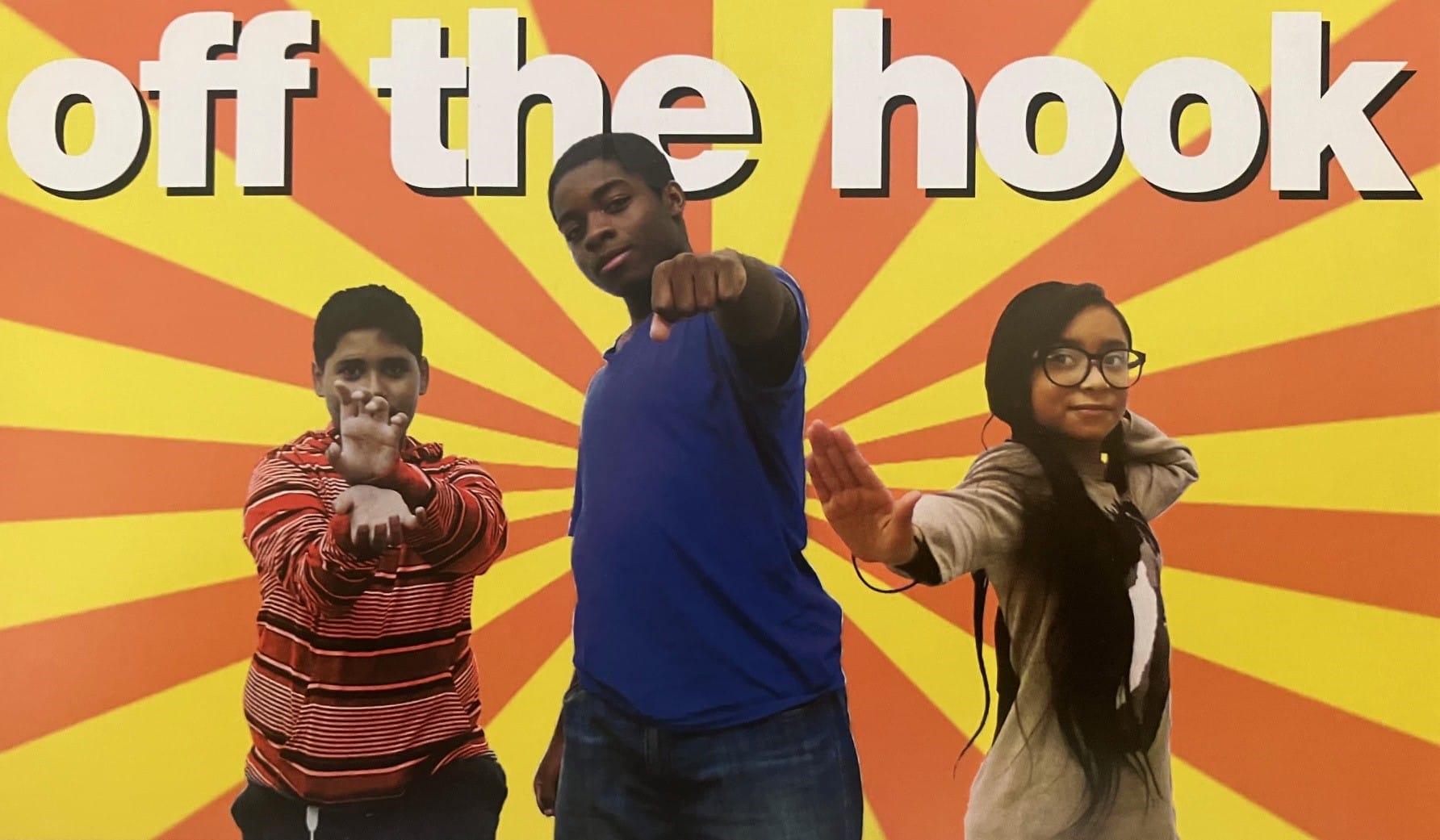 A postcard with the caption "off the hook" and three kids in front of stripes radiating out from the center. They are making various karate-style poses.