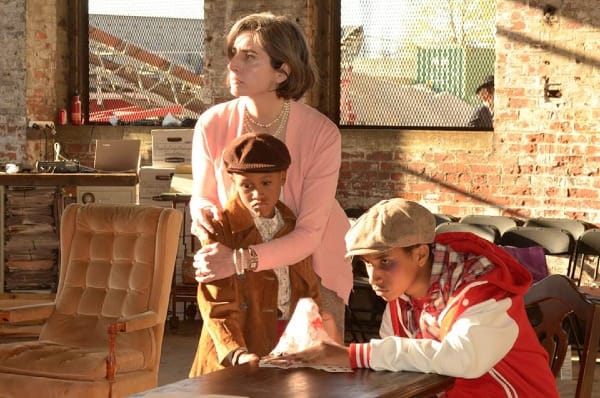 three members of the cast of "Enemy of the People" in gorgeous afternoon light