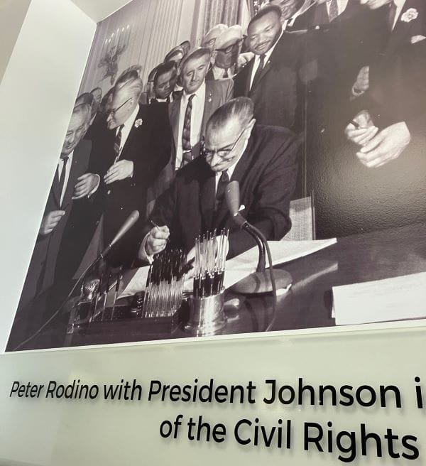 Peter Rodino standing next to Martin Luther King, Jr., as Lyndon Johnson signs the Civil Rights Act