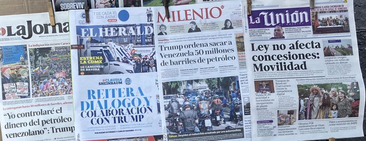 Four newspapers hanging at a newsstand in Cuernavaca. The various headlines reference primarily Trump and his statements about Venezuela.