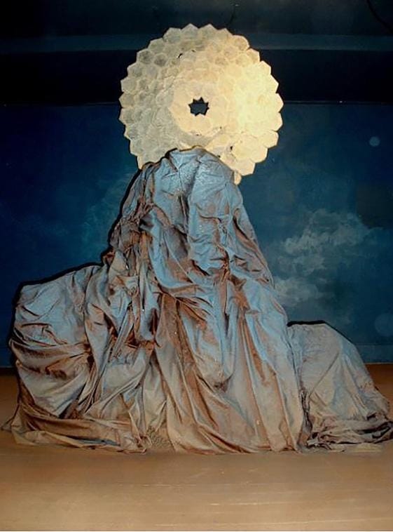 A large white circle on top of a mountain

Description automatically generated