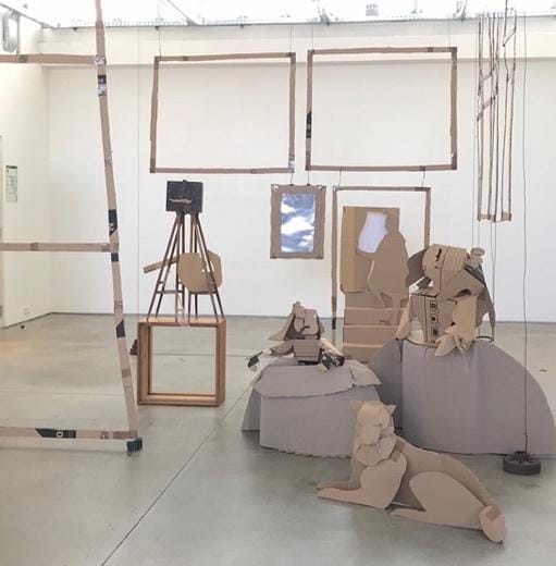 Cardboard sculptures in a room

Description automatically generated