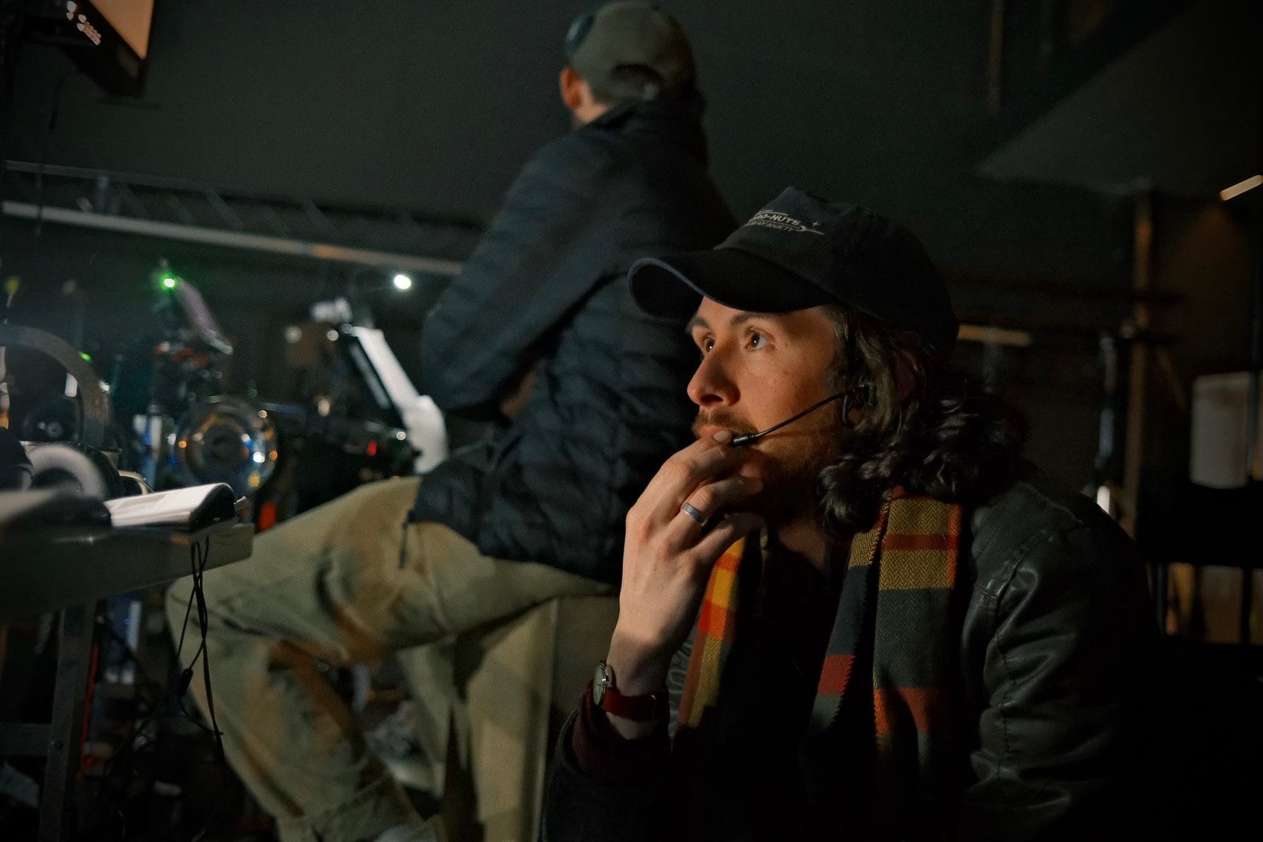 Zander Weaver wearing a headset while directing on the set of Arctic Skies in 2026.