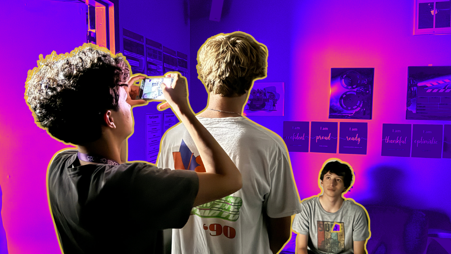 Young people shooting a scene using phones.