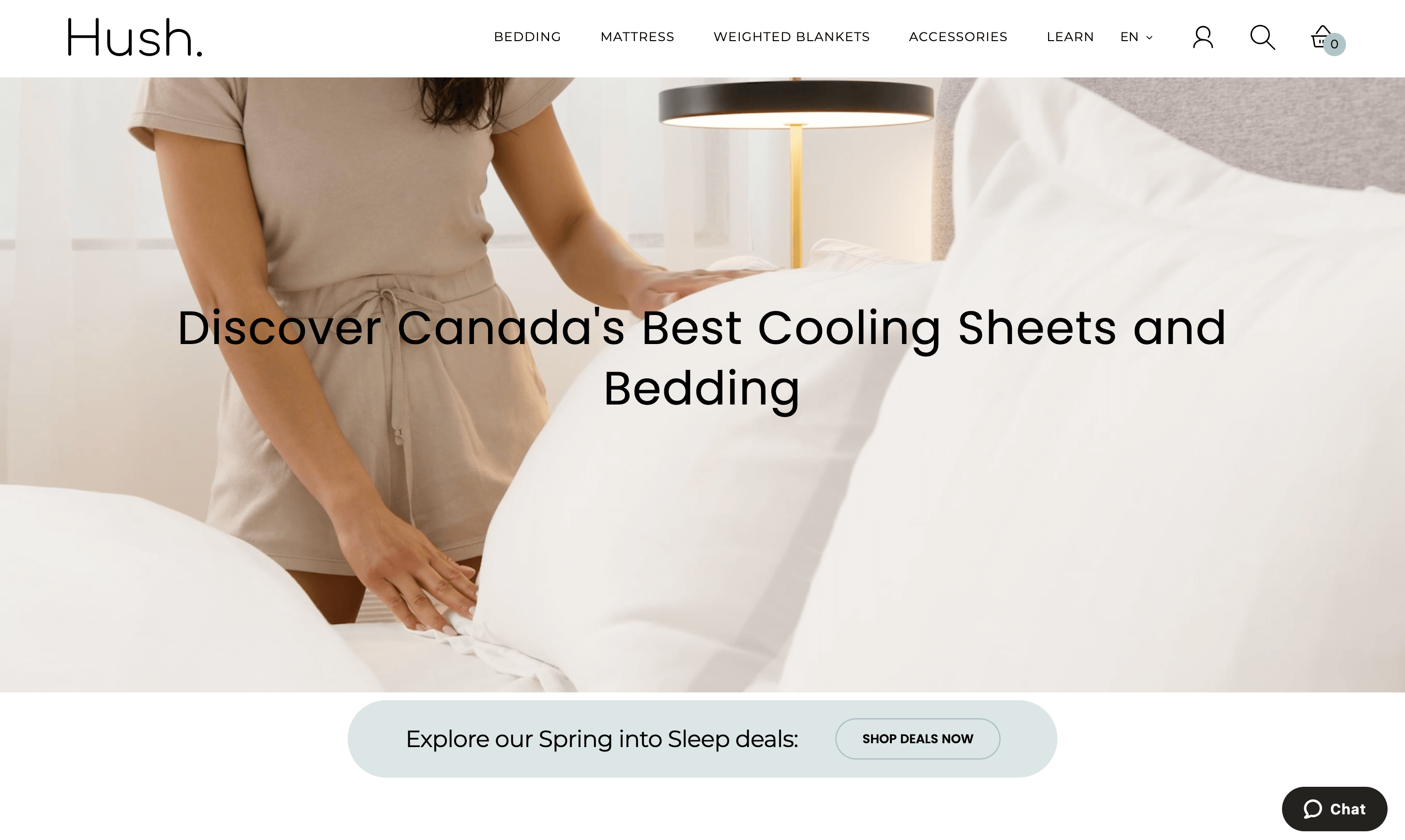 A screenshot of Hush’s homepage showing an image of someone making the bed with their cooling sheets.&nbsp;