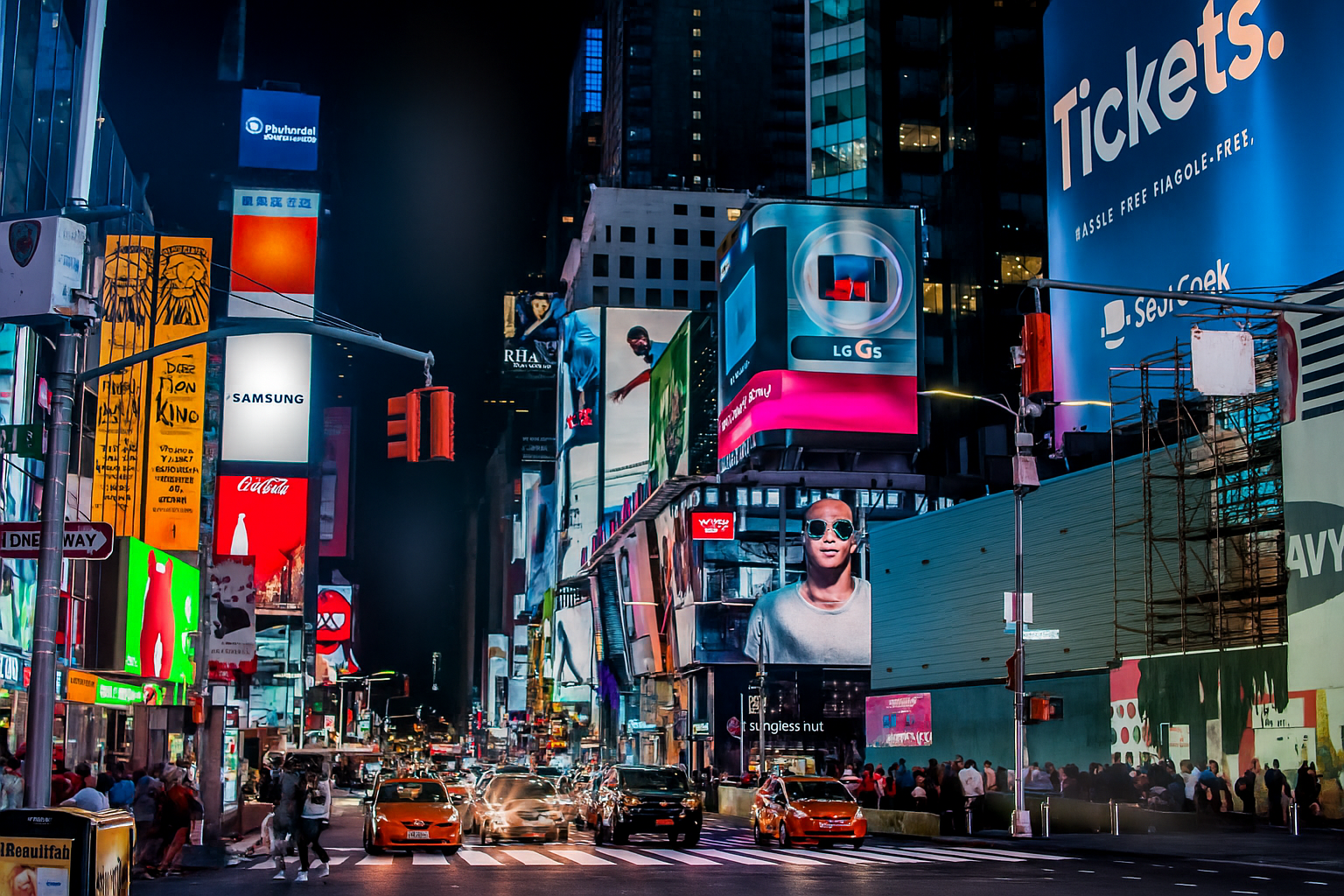 Times Square at night with digital billboards representing real-world loyalty program examples from major brands