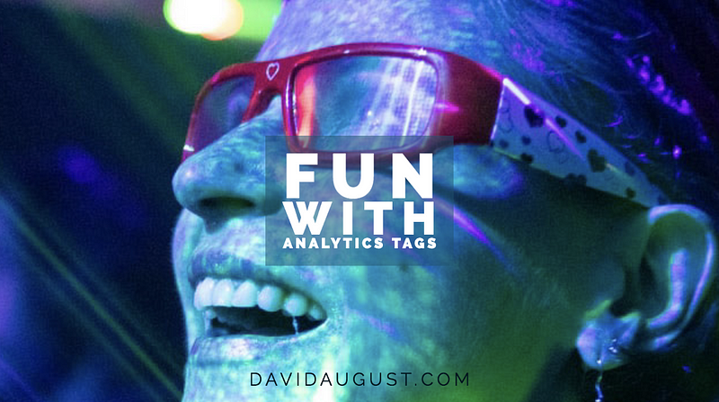 A person wearing red-framed glasses, smiling under colorful stage lighting, with the overlaid text "Fun with Analytics Tags" and "DAVIDAUGUST.COM".