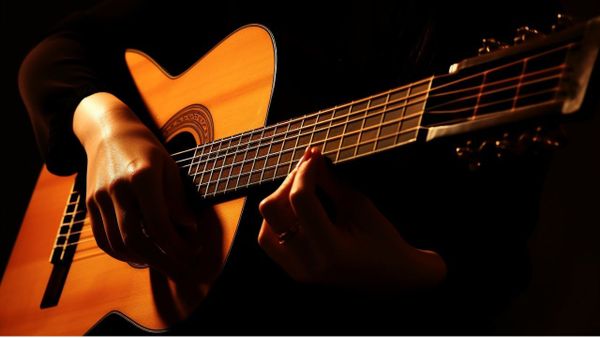 Close up of a Woman Playing Flamenco Guitar - Free Download