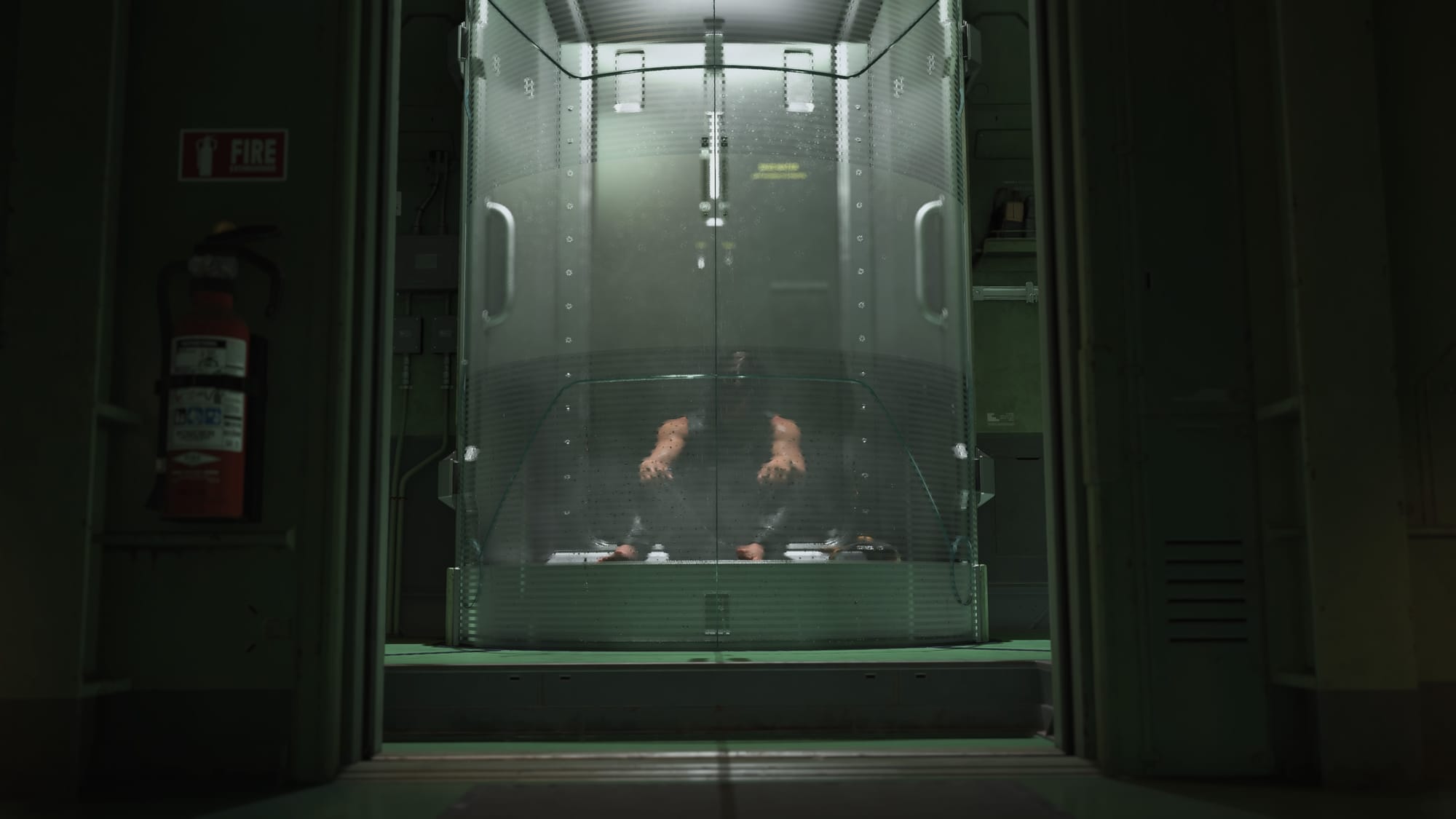 Sam sitting on the floor of a shower aboard the DHV Magellen in Death Stranding 2. 