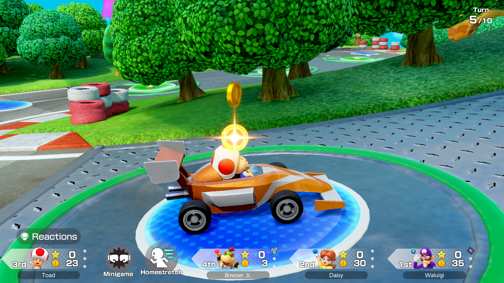 Toad driving a car on a racing circuit themed board