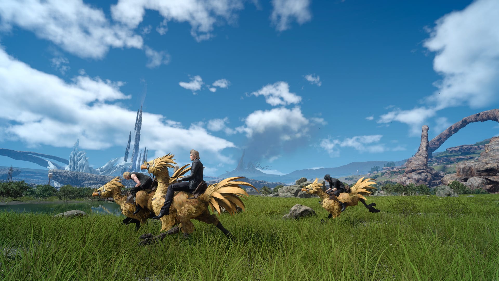 Shows Three chocobos and three riders on green grass with blue skies above. 