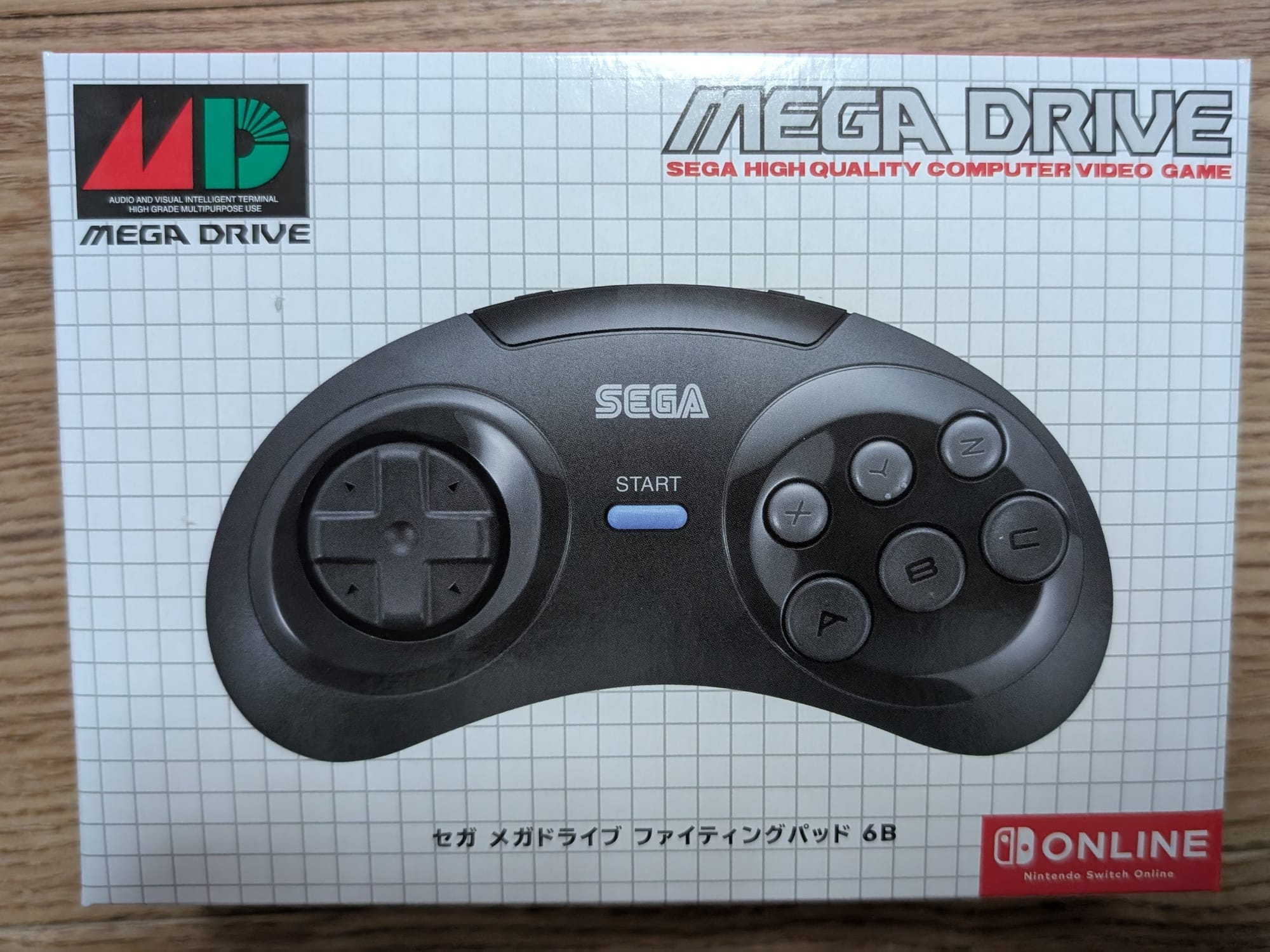 A boxed copy of the Bluetooth Sega Mega Drive Nintendo Switch controller. The box is styled to look like an original Mega Drive controller box.