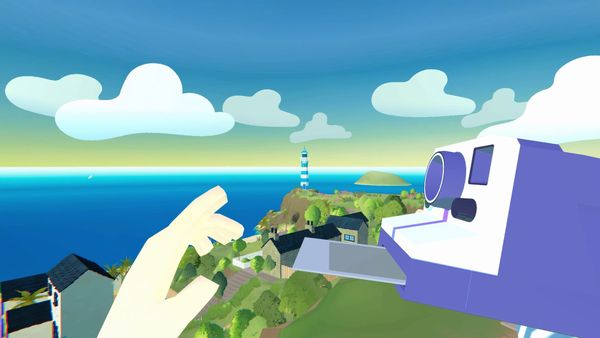 A hand grabbing a polaroid photo from a camera with an island village viewable in the distance