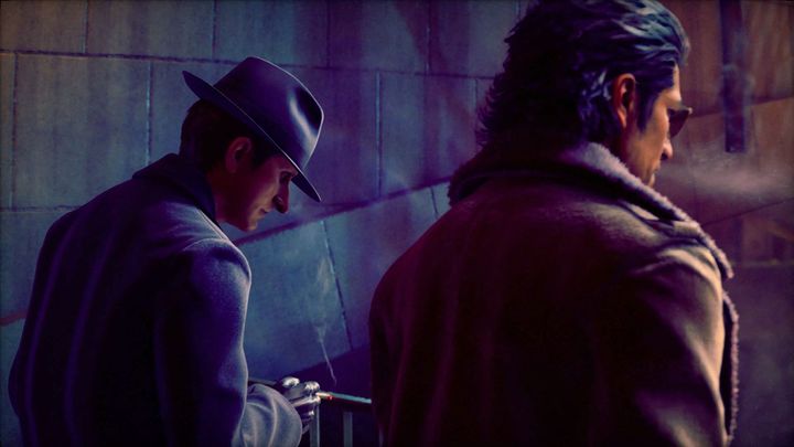 Two men smoking a cigarette each by a railing