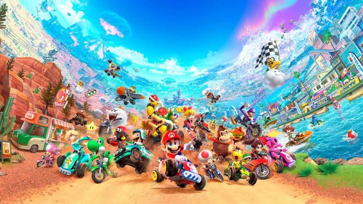 Multiple racers across a dirt track with some in the river to the right