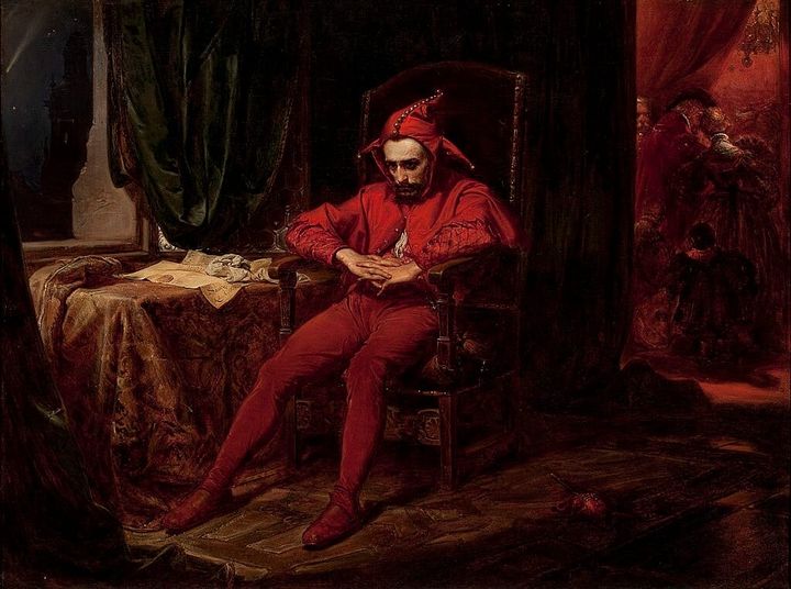 Oil painting of a lonely jester sitting in meditation while a feast goes on behind him.