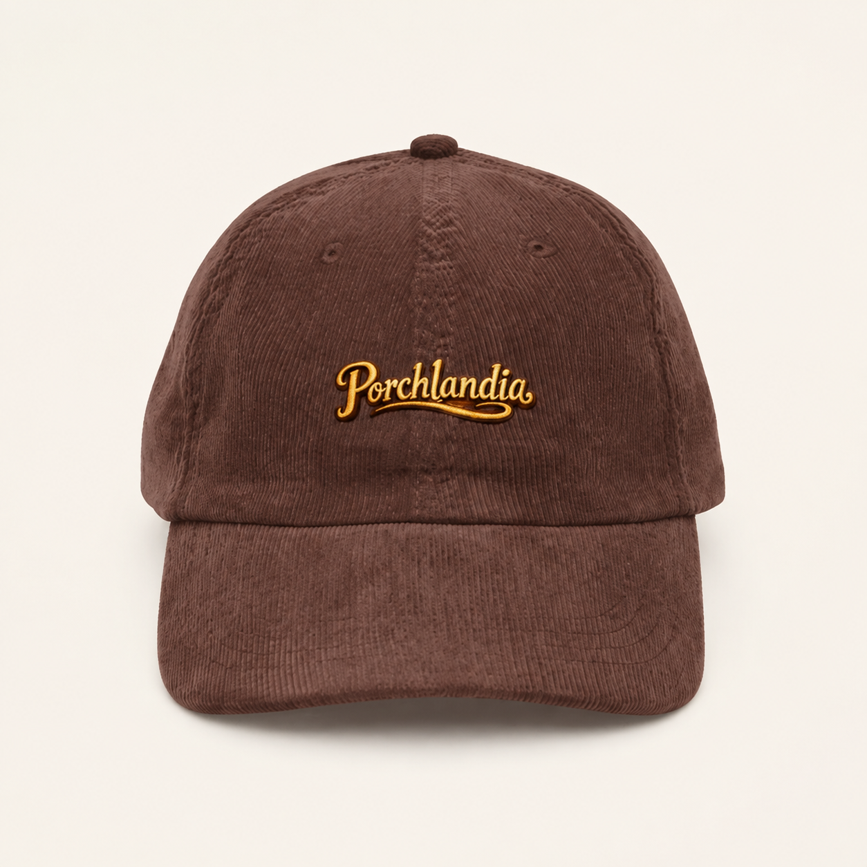 Brown corduroy cap embroidered with the Porchlandia logo in warm gold thread.