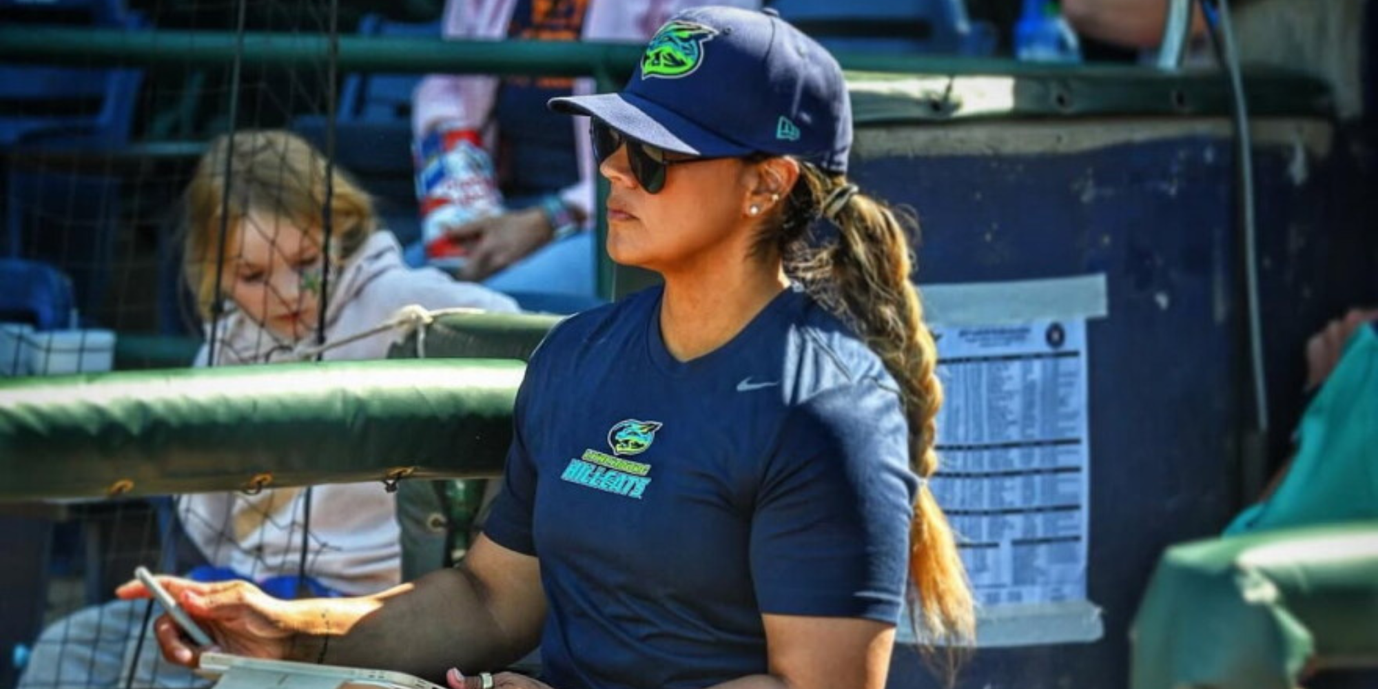 Amanda Kamekona in a Rays cap and shirt in a dugout